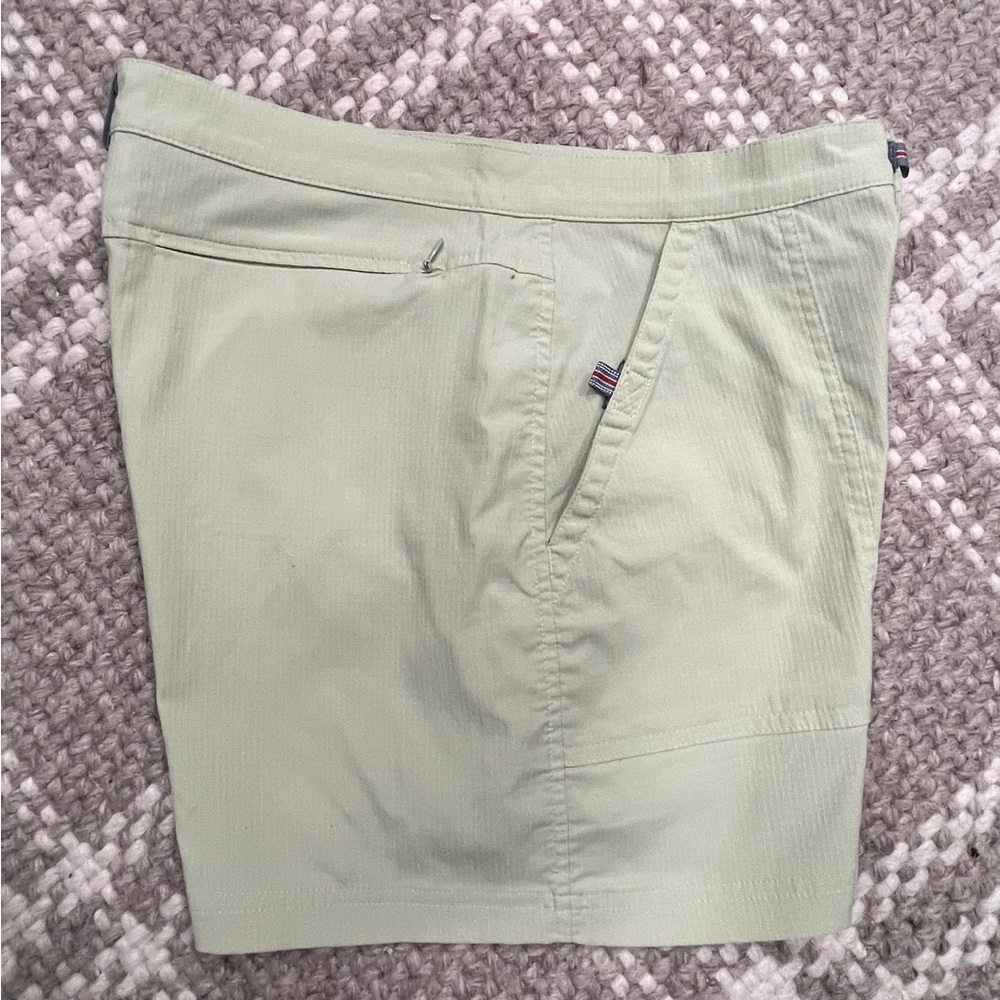 Athleta Women’s Light Sage Green shorts with reflective tabs